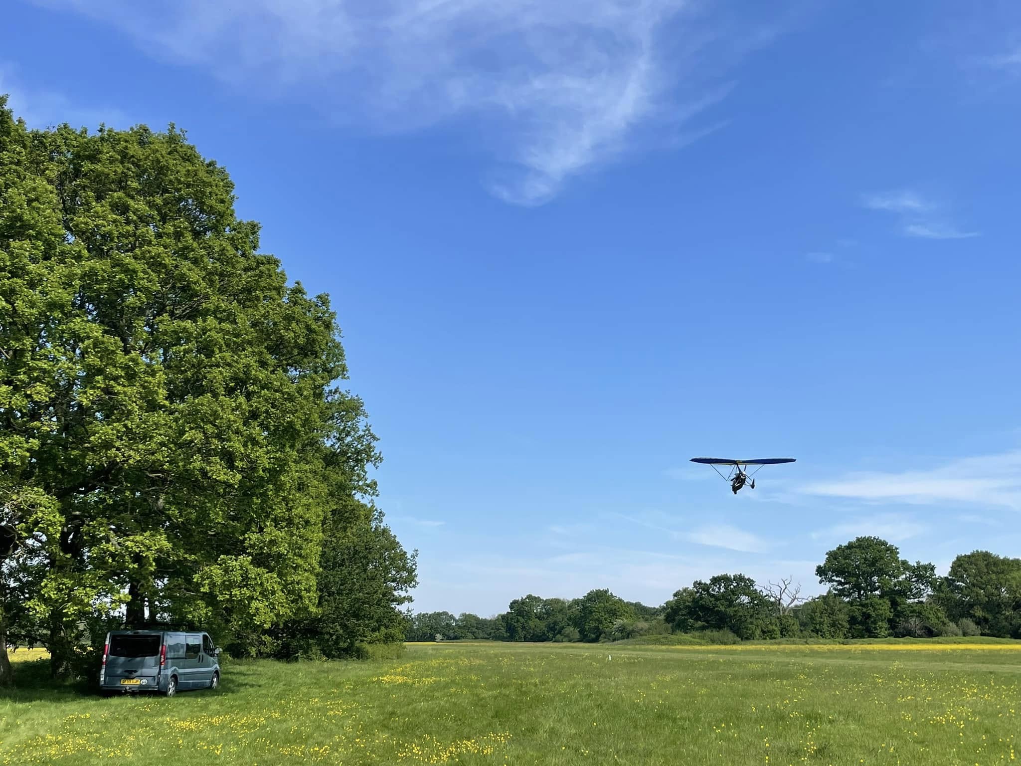 A microlight approaching a field to land